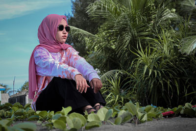 Woman looking at plants