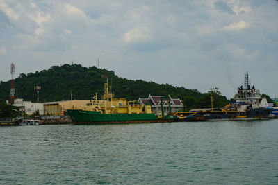 Boats in sea against sky