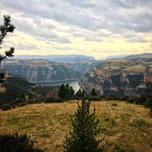 Scenic view of landscape and mountains against sky