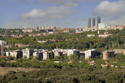 Buildings in city against sky