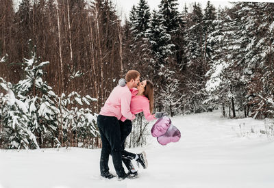 Full length of woman with snow covered land