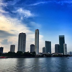 City skyline against cloudy sky