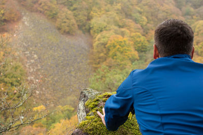 Rear view of hiker looking at mountain