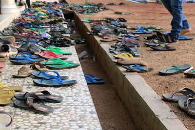 High angle view of shoes on footpath