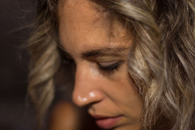 Close-up portrait of young woman looking away