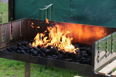 Burning fire on barbecue grill