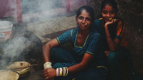 Young couple sitting on floor at home