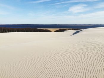 Sandy beach against the sky