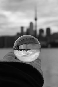 Close-up of person hand holding glass of water