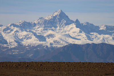 Scenic view of snowcapped mountains against sky
