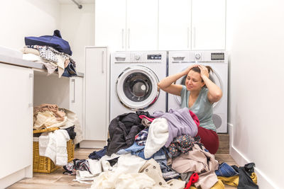 Frustrated woman at laundromat