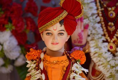 Close-up of decorated male statue