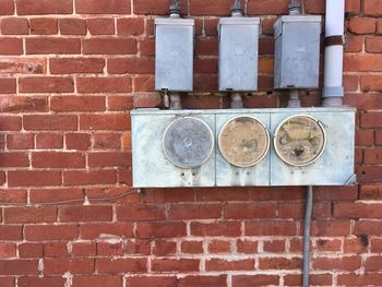 Mannequin on brick wall