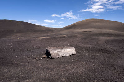 Scenic view of arid landscape against sky