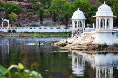 Reflection of building in lake in udaipur rajasthan india