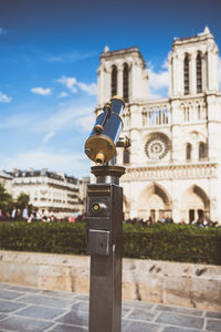 Close-up of tower against buildings in city