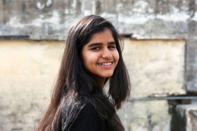 Side view portrait of smiling girl