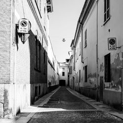 Street amidst buildings against sky