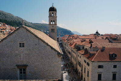 Buildings in town against sky in city