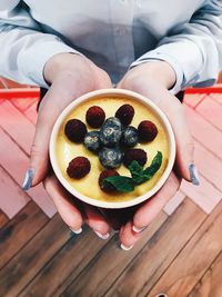 Midsection of woman holding food