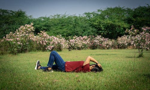 Woman lying on field