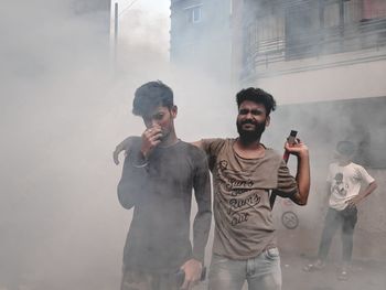 Men standing in city