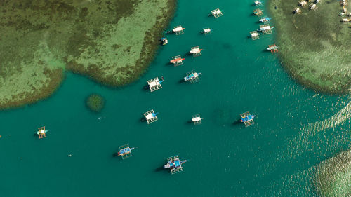 Many boats in the turquoise lagoon, view from above. seascape with blue bay and boats. 