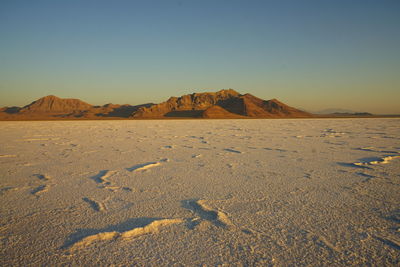 Scenic view of desert against clear sky