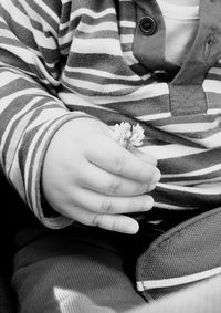 Close-up of cropped woman holding hands