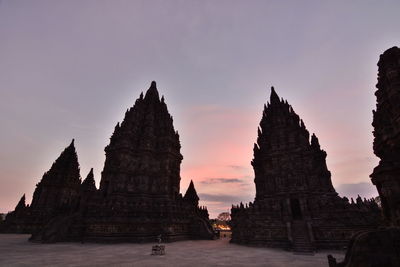 Historic building against sky during sunset