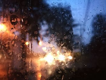 Raindrops on glass window during rainy season