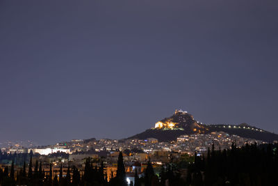 Illuminated buildings in city at night