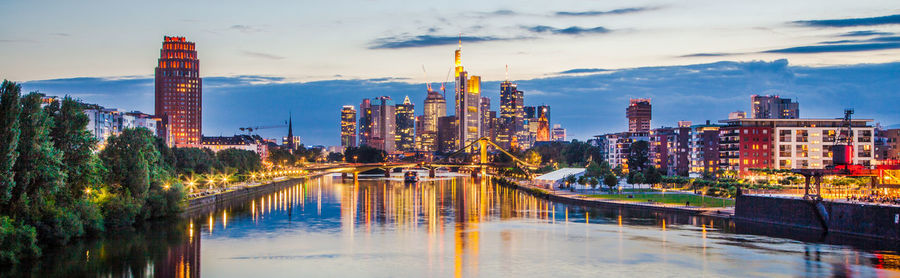 Panoramic view of modern buildings in city against sky