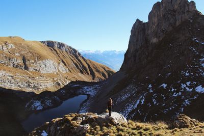 Scenic view of mountains against clear blue sky