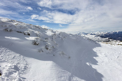 Scenic view of snow covered mountain against sky