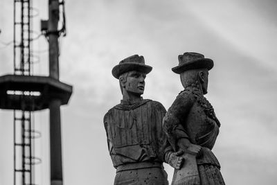 Low angle view of statue against sky