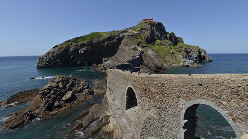 Panoramic view of the  roky peninsula and its hermitage against the clear blue sky