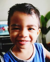 Close-up portrait of smiling boy