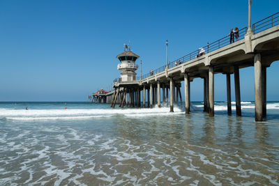 Pier over sea against clear sky