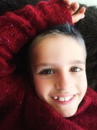 Close-up portrait of smiling young woman