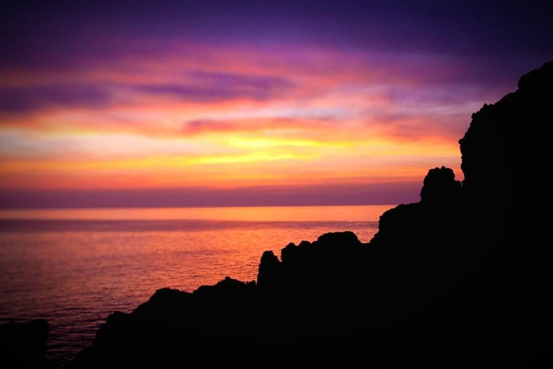 SCENIC VIEW OF SEA DURING SUNSET