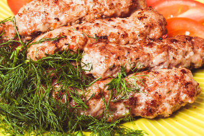 High angle view of meat on barbecue grill