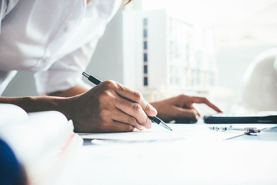 Midsection of woman working in office