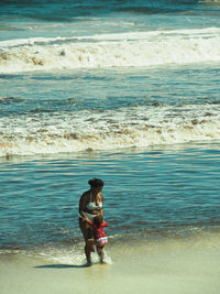 Full length of woman on beach