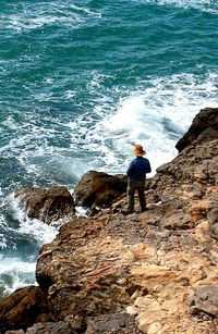 Full length of man standing on beach