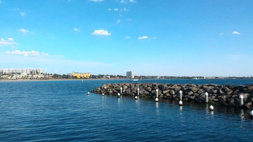 Scenic view of sea against blue sky