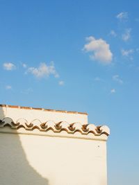 Low angle view of building against blue sky