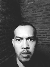 Portrait of man against wall