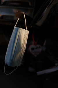 Close-up of heart shape hanging on paper