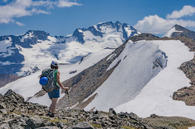 Full length of man skiing on snowcapped mountain